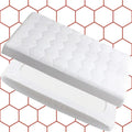 Two white rectangular objects on a red hexagonal patterned background
