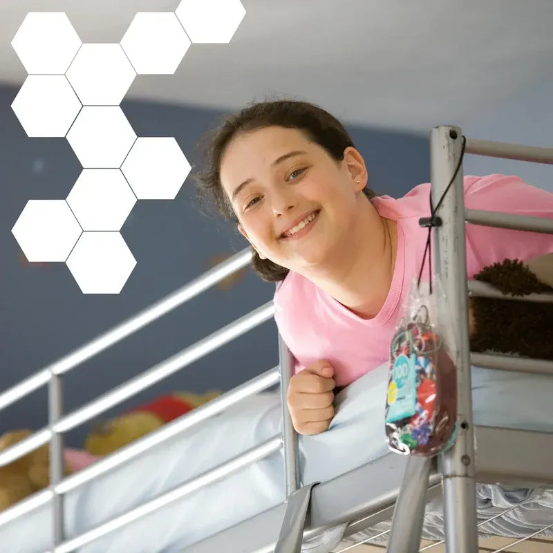 Young girl in a pink shirt standing on a staircase with a blurred background