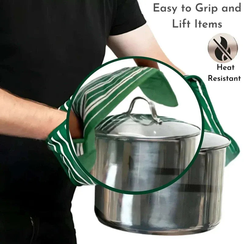 Person holding a pot with green gloves, emphasizing ease of grip and heat resistance.