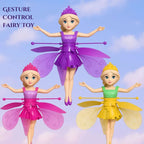 Three fairy toy dolls with colorful dresses and wings against a blue sky background.