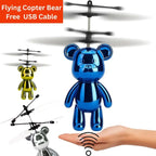 Blue flying teddy bear toy with USB cable on a white background
