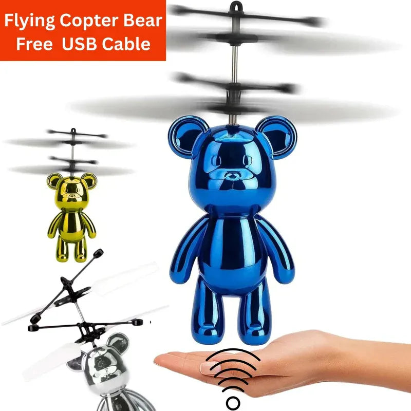 Blue flying teddy bear toy with USB cable on a white background
