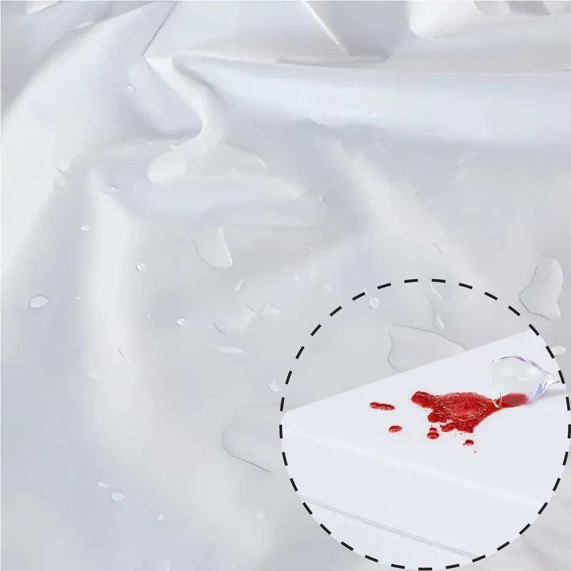 Red liquid stain on a white fabric with a circular outline.
