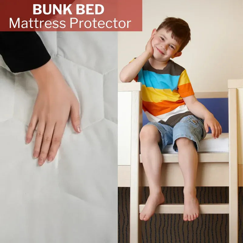 Child sitting on a bunk bed with a mattress protector, showing a close-up of the product.