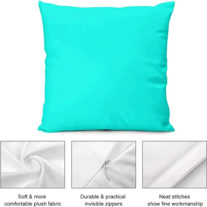 Turquoise pillow with fabric texture, zipper, and stitching details on a white background