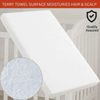 White terry towel on a crib with close-up of texture and 'Quality Assured' badge.