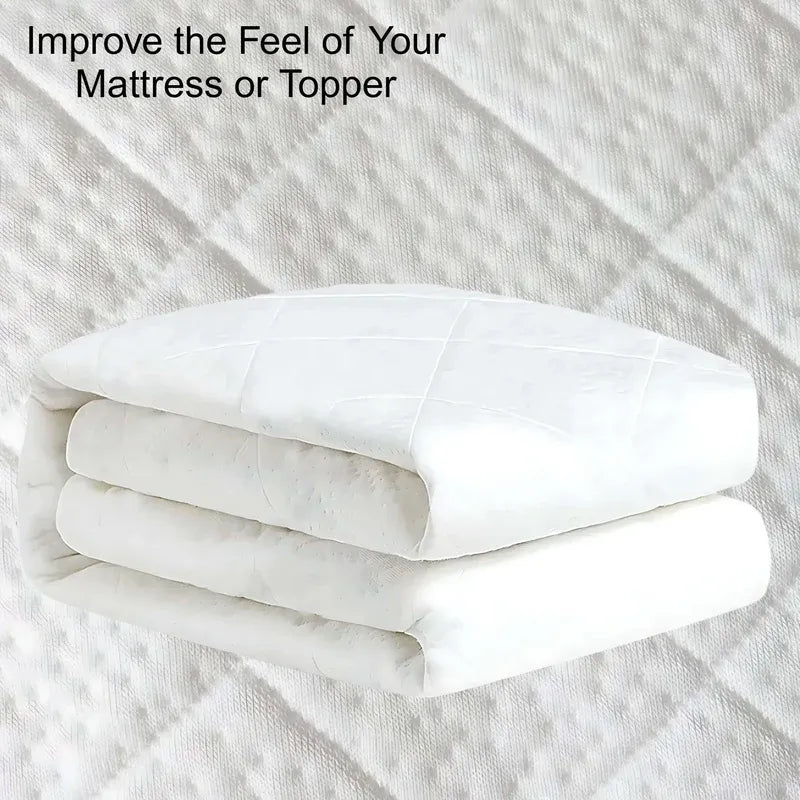 White mattress topper on a textured surface with text 'Improve the Feel of Your Mattress or Topper'.