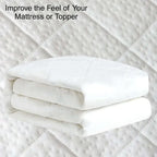 White mattress topper on a textured surface with text 'Improve the Feel of Your Mattress or Topper'.