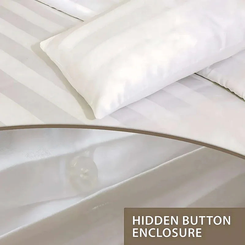 White bedding set with a close-up of a pillow and fitted sheet, labeled 'Hidden Button Enclosure'.