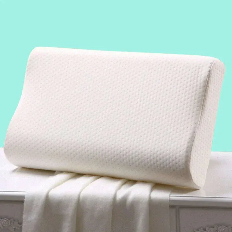 White pillow on a white surface with a light blue background