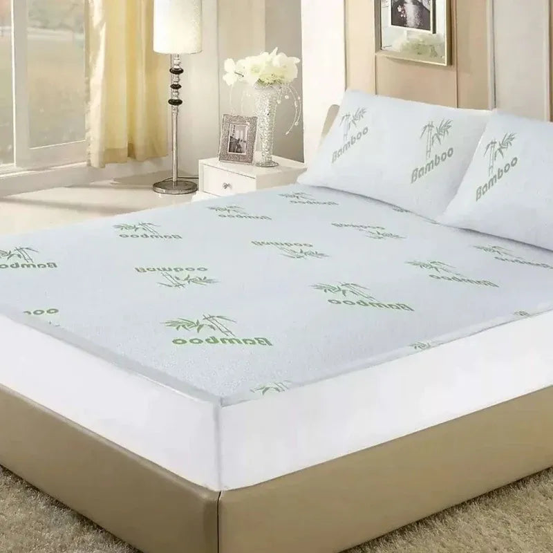 Bamboo mattress cover set on a bed in a bedroom setting