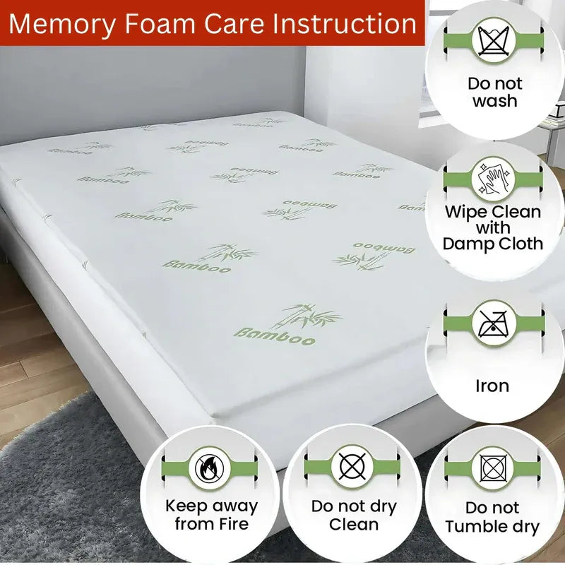 Memory foam mattress topper with care instructions on a bed