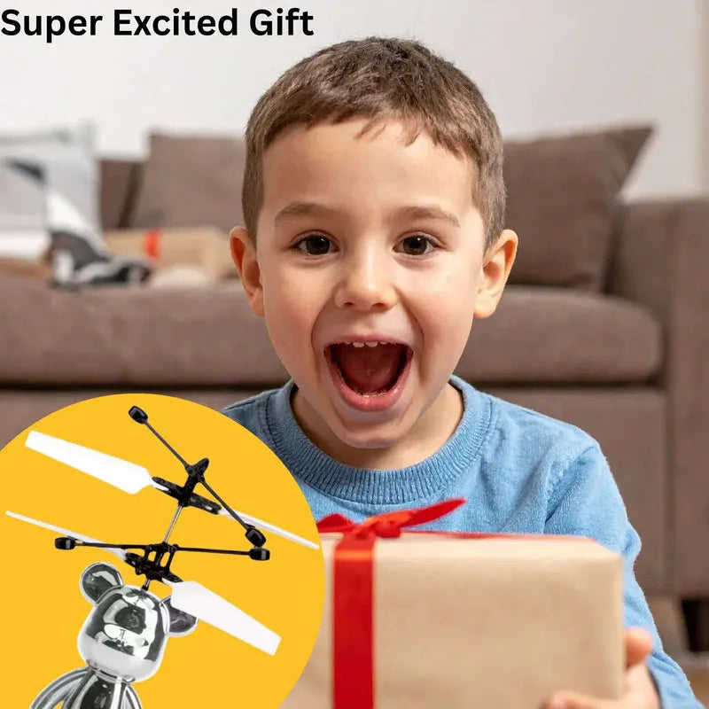 Child excitedly opening a gift with a toy drone inset, in a living room setting.