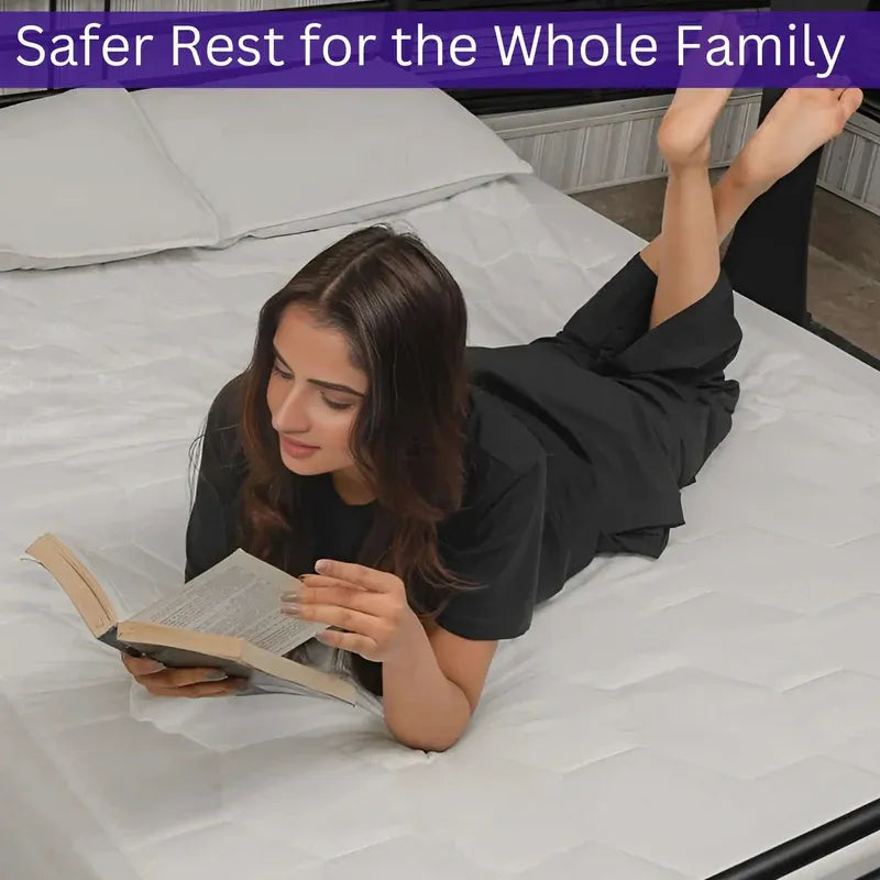 Woman reading a book on a bed with text 'Safer Rest for the Whole Family' at the top.
