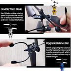 Helicopter with flexible wind blade and upgrade balance bar, held by a hand.