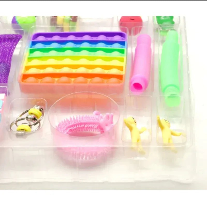 Colorful set of kitchen tools including a silicone mold, brush, and other utensils on a white background.