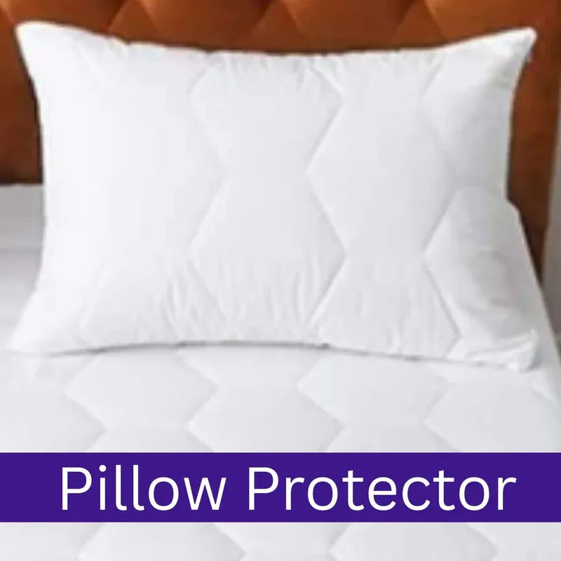White pillow protector on a bed with a wooden headboard.