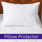 White pillow protector on a bed with a wooden headboard.