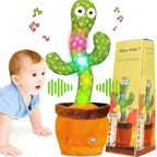 Dancing cactus toy with colorful lights and a baby interacting with it, next to its packaging.