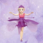 Fairy doll with purple and pink outfit on a purple background
