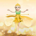 Fairy doll with yellow wings and a green dress on a light yellow background