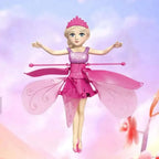 Pink fairy doll with wings and a wand on a colorful background