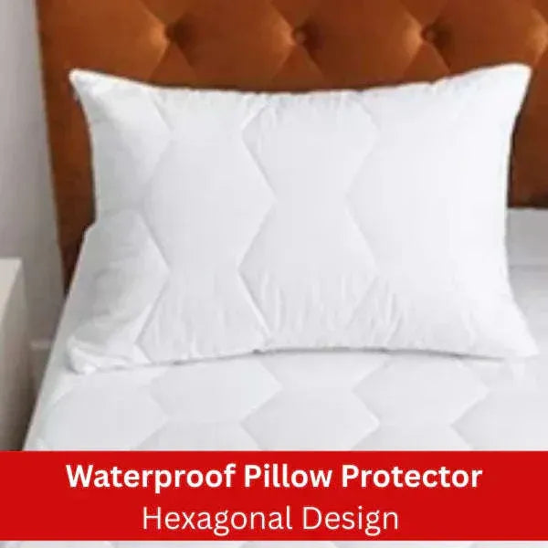 White waterproof pillow protector with hexagonal design on a bed, featuring a brown headboard.