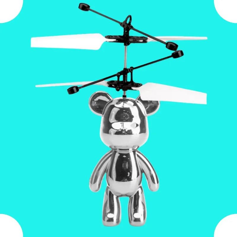 Metallic bear-shaped RC helicopter on a turquoise background