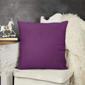 Purple pillow on a white chair with a dark gray background