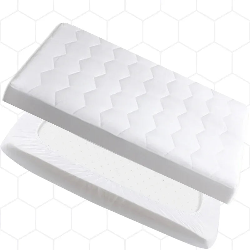 A white contoured mattress topper with a quilted zigzag pattern on top and a perforated inner layer, shown floating against a white background with a faint hexagonal grid pattern.