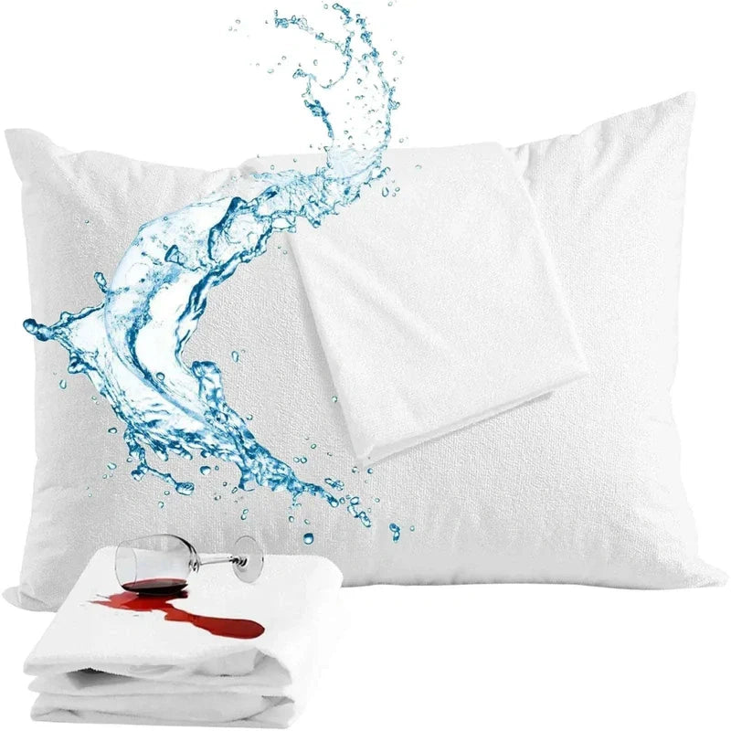 White pillowcases with water splash design and a glass of red wine spill on one, on a white background.